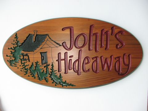 Engraved sign Johns Hideway